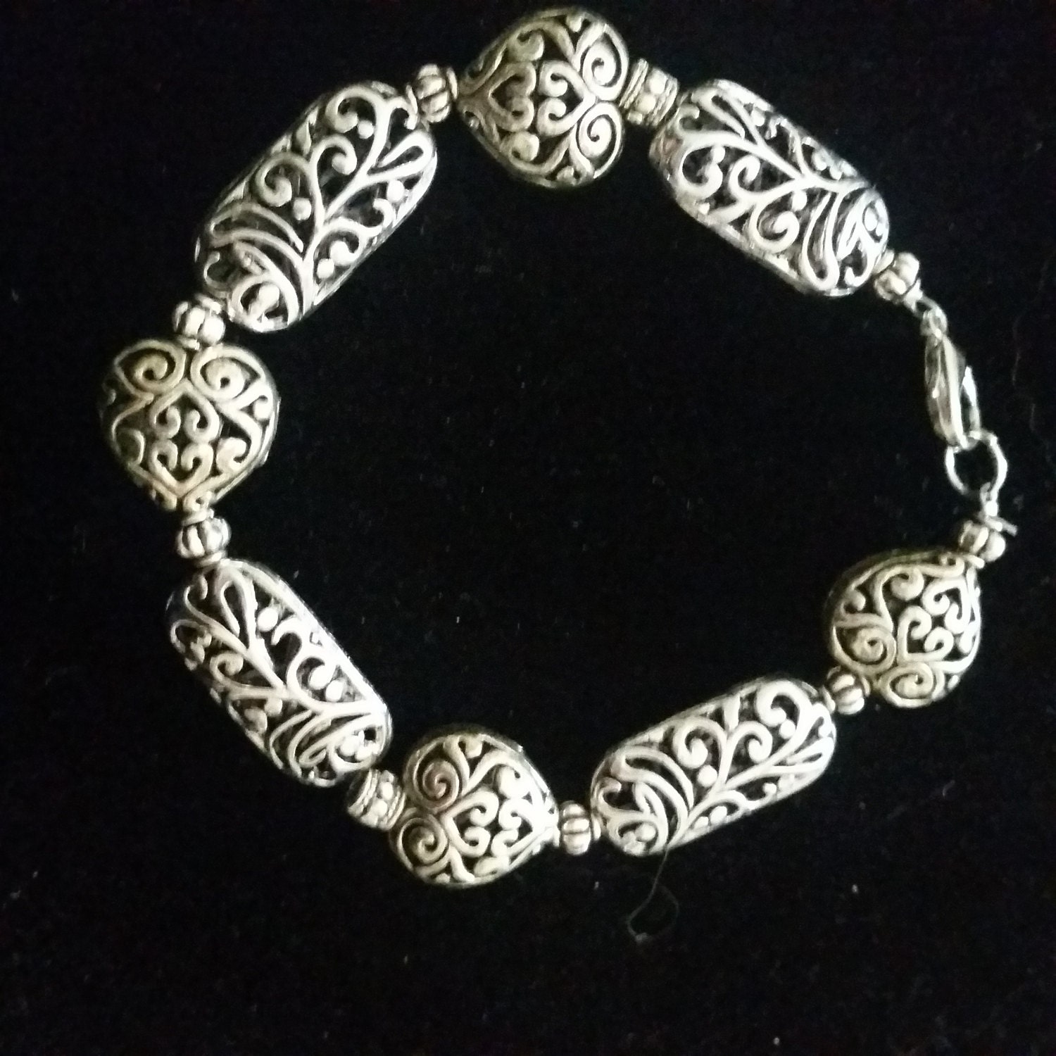 Silver filigree bracelet with hearts
