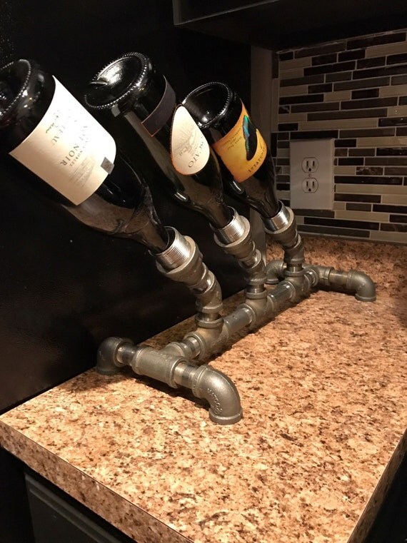 Items similar to Iron Pipe Wine Rack on Etsy