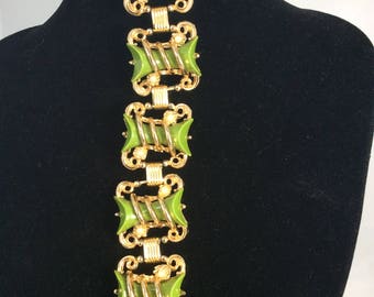 Unusual and fab 1950's Scrollwork Bracelet with Olive Green Medallions .
