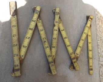Folding Rule. Wooden folding ruler.Vintage item from the 1940s. One side in inches, the second side is unusual for me measures.man cave
