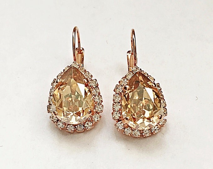 Swarovski crystal teardrop canary fancy yellow golden shadow 14x10 pear shape lever back drop earrings in rose gold.