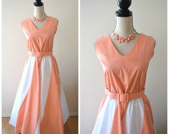 Lovely vintage salmon and white striped sleeveless belted tea length dress with full skirt.
