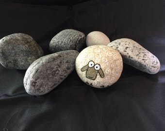 Hand painted beach stone from the Isle of South Uist, Outer Hebrides, Scotland.