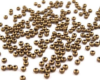 50 metal spacer beads bronze 2 x 3 mm