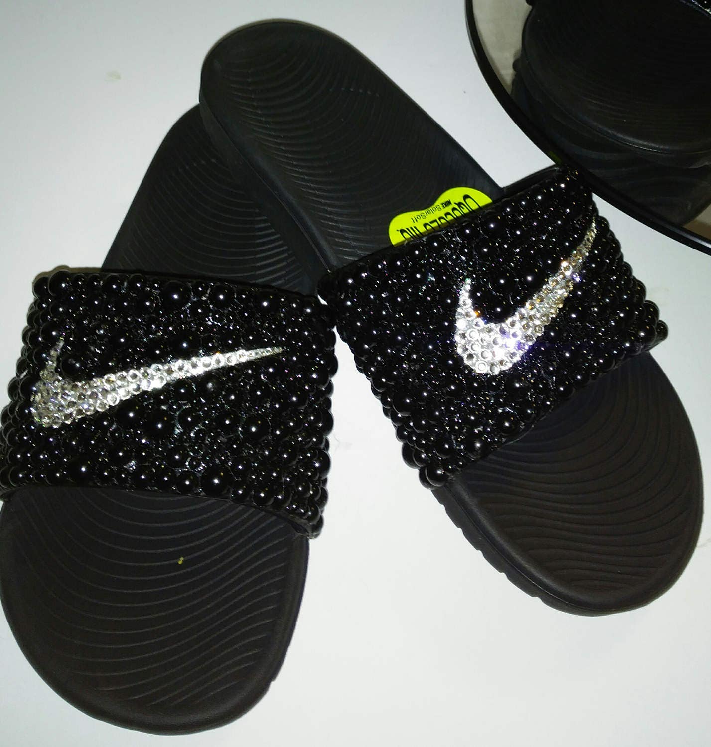 black and yellow nike slides