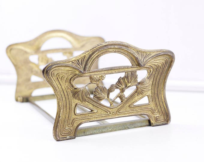 Brass book slide, antique book shelves, 1910s art nouveau desktop book stand, folding telescopic book stand /w pine branches and pine cones