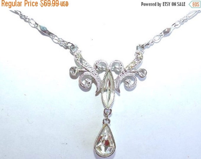 Storewide 25% Off SALE Beautiful Vintage Silver Tone Teardrop Crystal Necklace Featuring a Sparkling Silver Scrolling Setting and Faux Marca