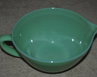 Fire King Jade-ite mixing bowl with handle and pouring sprout.