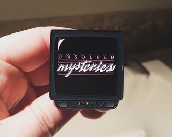 Unsolved Mysteries TV Enamel Pin