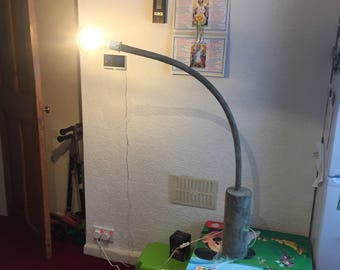 Unique curved concrete floor lamp