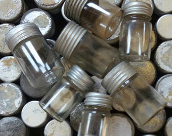 Three Vintage Small Glass Vials..Metal lids