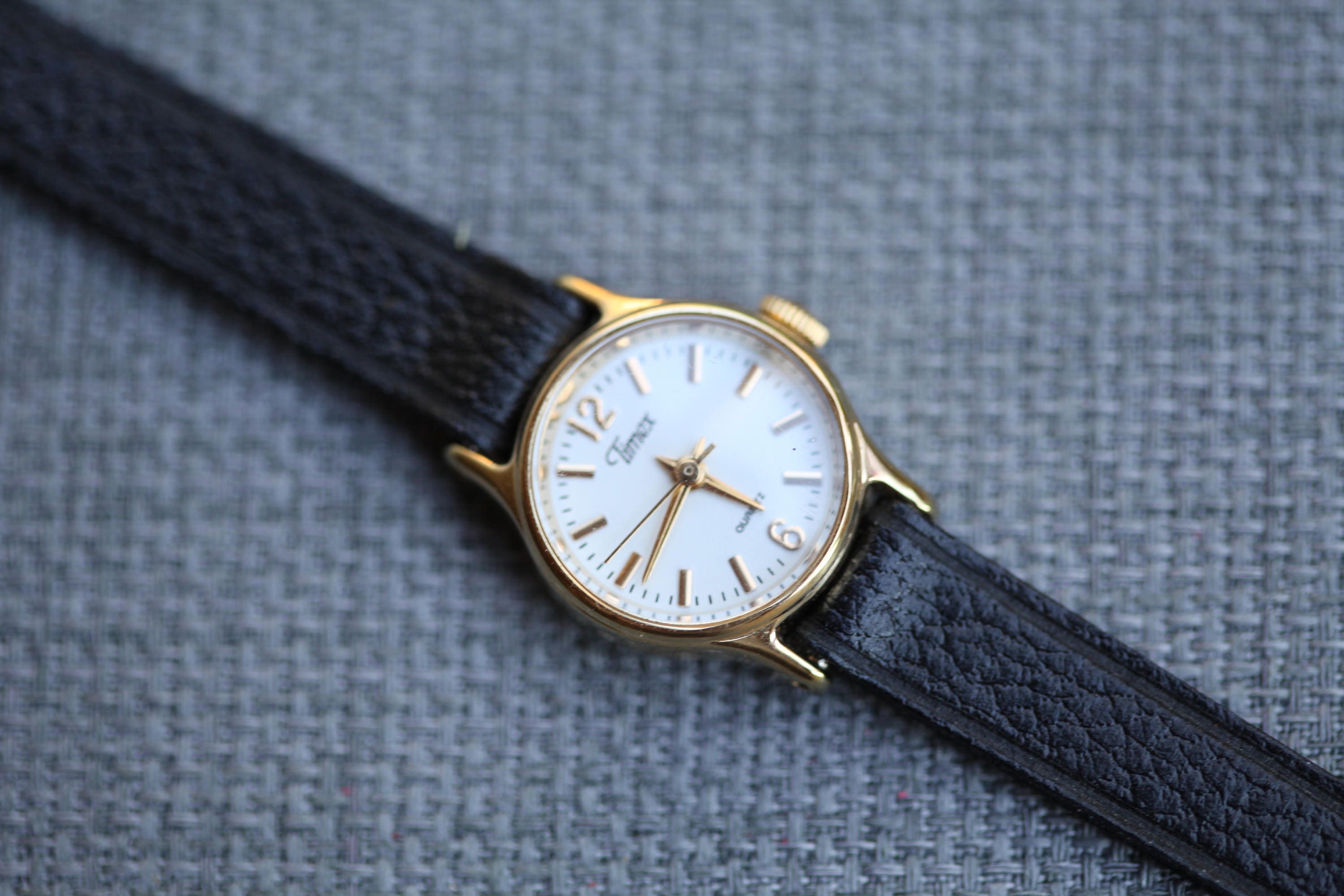 vintage Timex quartz watch very small with black leather band