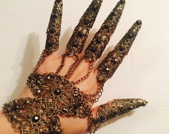 Crystal gauntlet with nail guards, claws, armor bracelet, crystal glove or slave bracelet, made in brass filigree with hematite crystals.