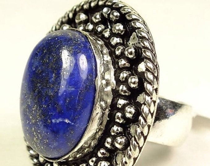 Storewide 25% Off SALE Stunning Lapis cocktail ring Featuring an oval center stone set in white metal