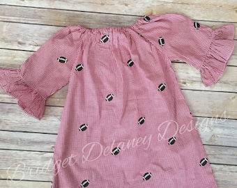 Monogrammed girl's red gingham dress with football embroidery. Monogrammed or personalized.