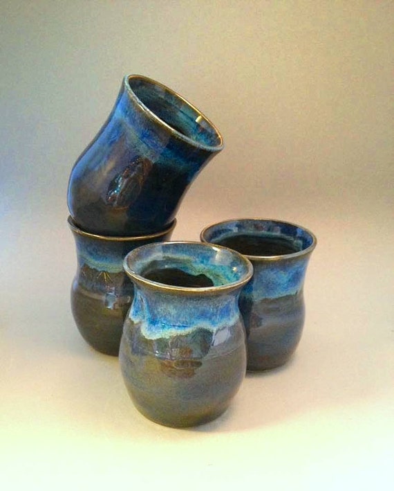 Set of four stoneware tumblers in shades of blue pottery