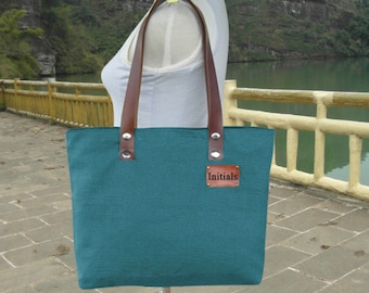 Teal green canvas tote bag, leather strap shoulder bag for women with personalized tag.