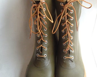 green rubber boots with yellow laces