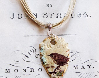 Hand made Ceramic Wren Pendant with an organza/cotton necklace, fired 5 times and highlighted with gold - a unique gift made in the UK