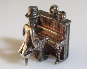 Silver Nuvo Man Playing a Piano Moving Charm