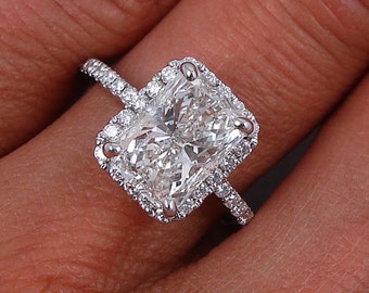 Vintage 2.77 ctw Radiant cut diamond ring with a striking 2.12