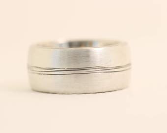 Bound Together in the middle recycled sterling silver mans wedding band.