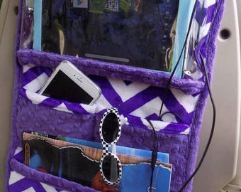 Car organizer for a iPad or tablet, car accessory can be used for teens and children which hangs securly on the back of the car seat