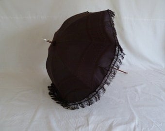 Beautiful condition genuine antique Victorian c1850 black silk parasol. Steampunk or Gothic umbrella with original cover and fringing.