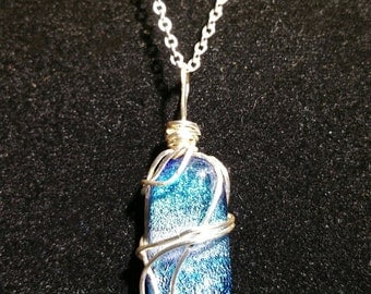 Fused dichroic glass wire wrapped pendant on a sterling silver chain