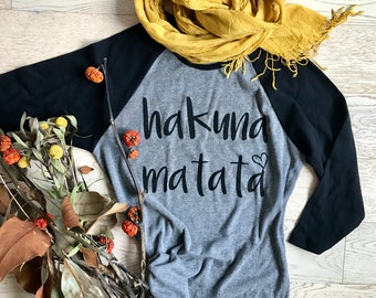 Hakuna Matata. Disney Shirt. Clothing. Women's T Shirts. T Shirts. Ladies Fit. Womens's Raglan Shirts. Baseball Raglan Shirts
