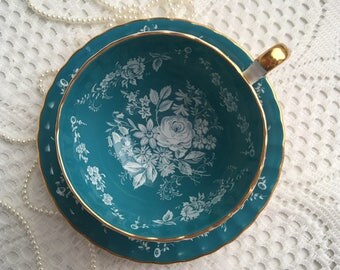 Reserved Aynsley China Tea Cup and Saucer, Blue with Hand Painted White Floral Centres and Gold Trim