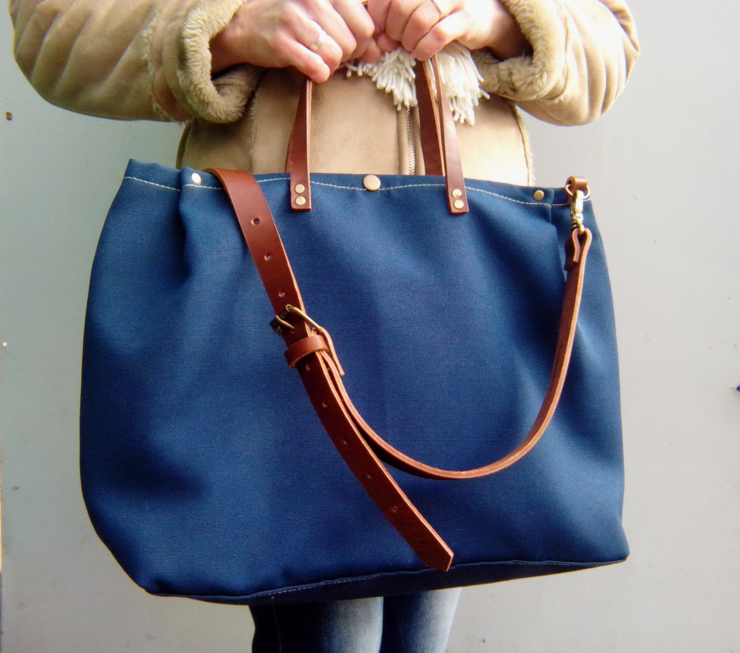 Waxed canvas tote bag with leather handles and leather