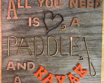 All You Need is Love, a Paddle and a Kayak sign on distressed wood with painted hardware and letters. Great lake house decor!