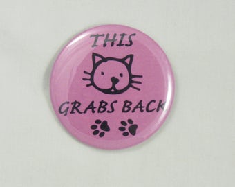 This Pussy Grabs Back Button. 2.25" pin-back button. Protest Buttons. Resist Buttons. Anti-Trump Buttons. Resistance Buttons