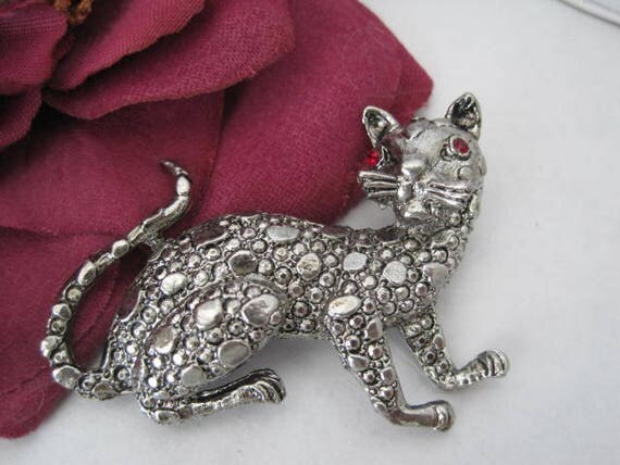 Kitty Cat Pin - Red Rhinestone Eyes - Bumpy silver tone body - Cat Brooch