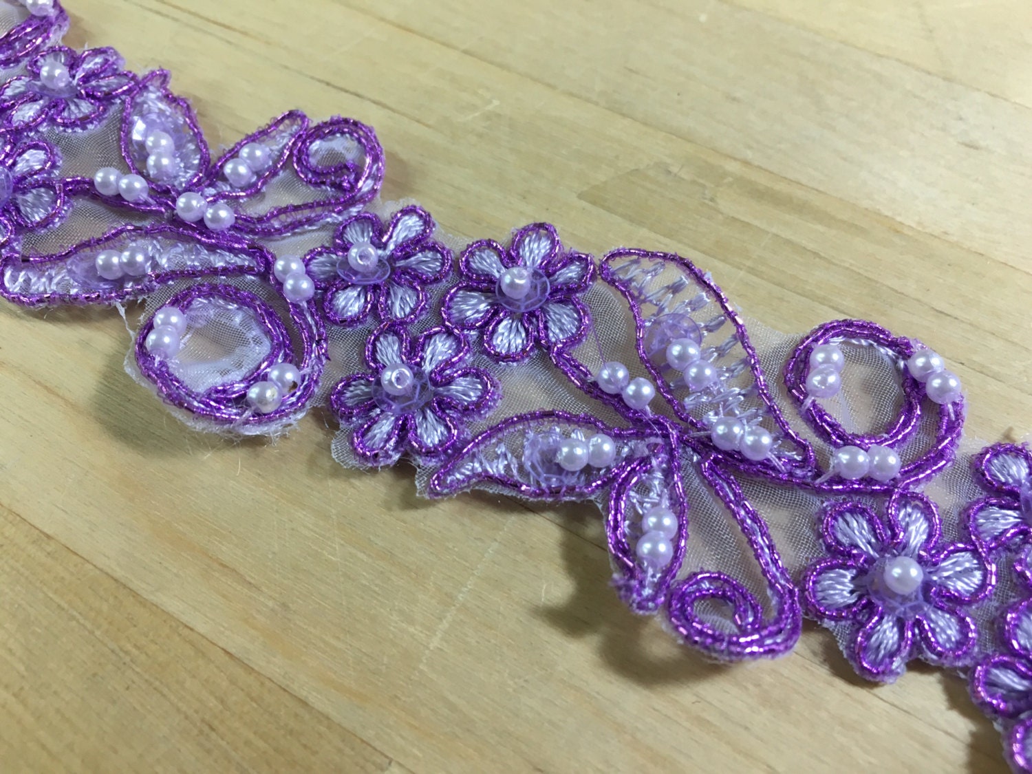 Purple beaded floral lace trim from SupremeFabrics on Etsy Studio