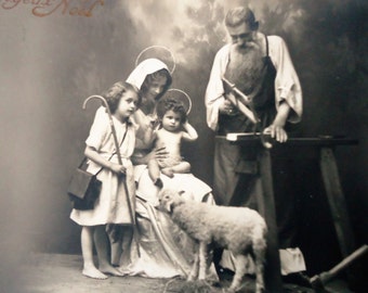 Antique Christmas postcard - Nativity baby Jesus, girl child staff, Mary halo sheep, Joseph carpenter, french sepia 1910
