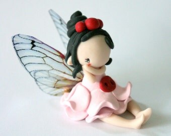 fairy on a swing figurine