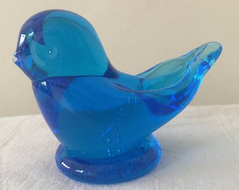 A small blue glass bird figure by Leo Ward.