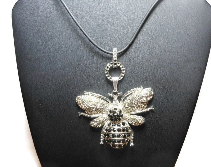 Large bee pendant, silver tone bumble bee, pave encrusted clear and black rhinestones, black cord, fancy connector with black enamel
