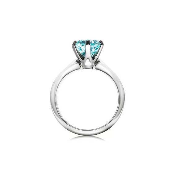 Aquamarine solitaire engagement ring made from 950 Platinum