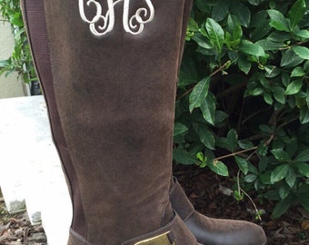 monogram plaque long leather boots