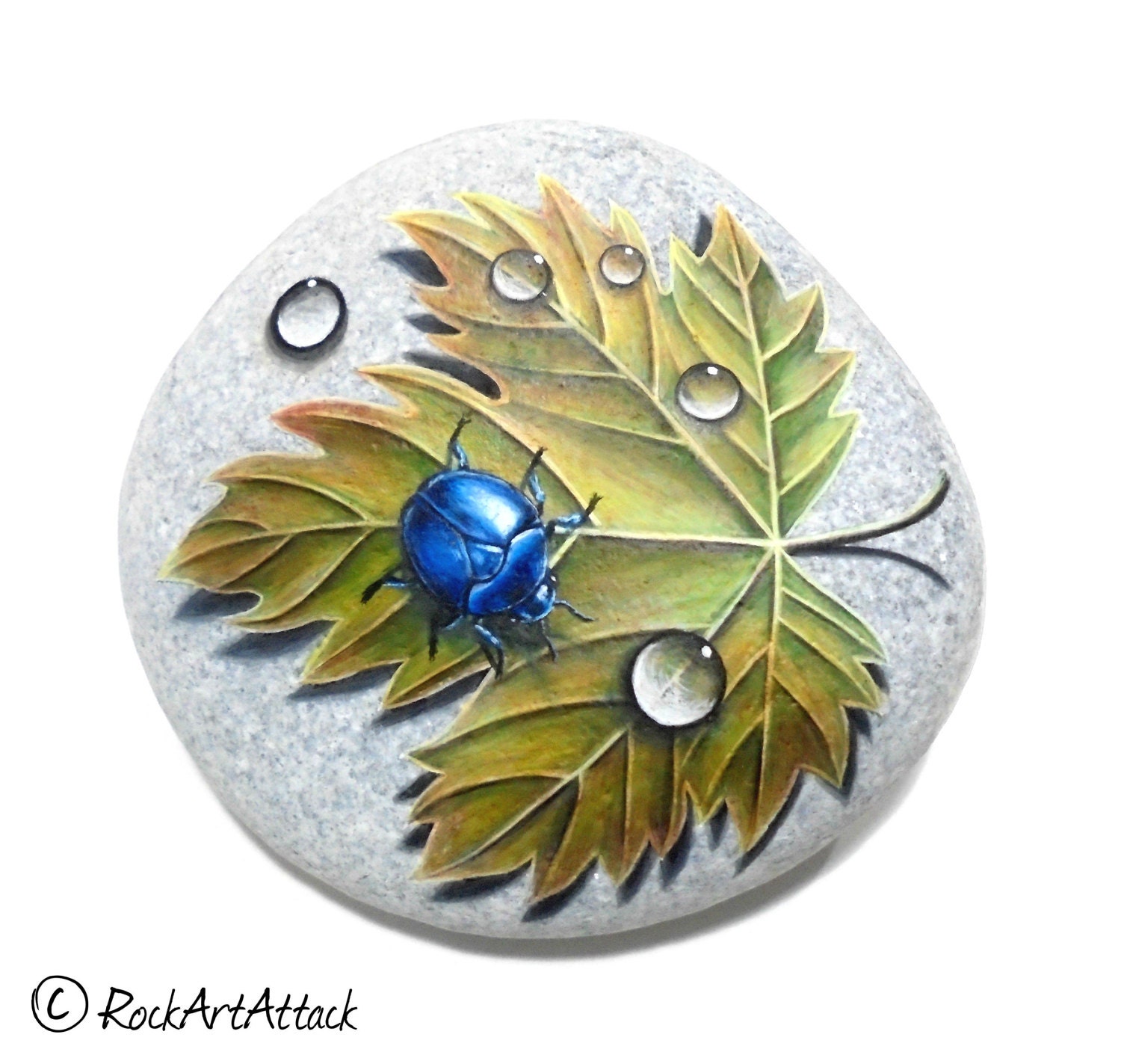 Hand Painted Rock with Blue Beetle Dew Drops And Autumn Leaf