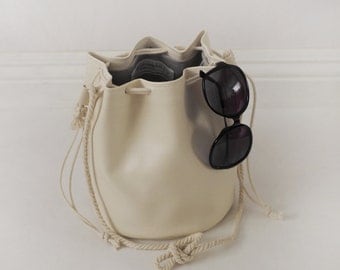 Faux leather drawstring bucket bag with cotton rope