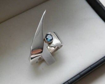 silver ring with topaz