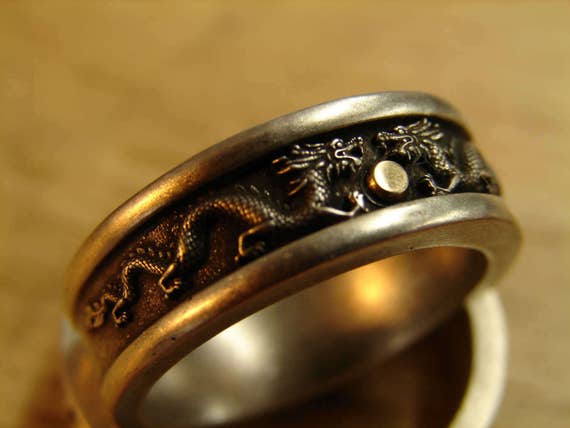 Dragon ring. To be worn as a wedding band, engagement or statement ring. Two tone ring with solid sterling silver and solid 10k yellow gold.