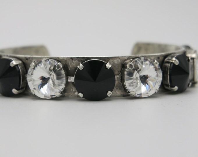Statement Swarovski Crystal eye catching black and white clear crystal bangle bracelet in antique silver.