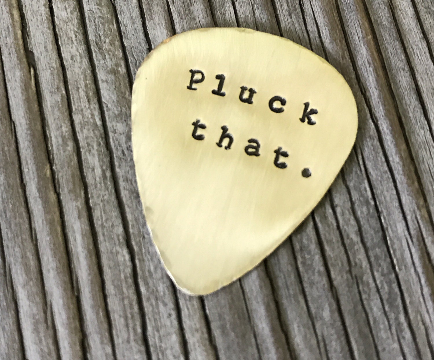 Hand stamped brass guitar pick pluck that. ready to ship fun