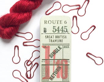 Knitters' travel tins with stitch markers