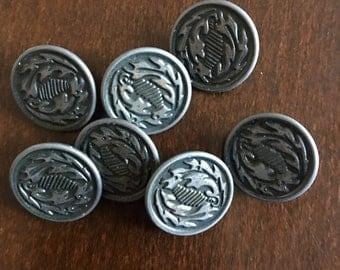 7 Antique metal buttons with a pewter finish aluminium back abstract leaf design French estate sale.